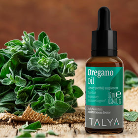 TALYA huile d'origan sur une table en bois