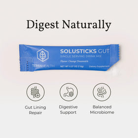 Terra Health Essentials Solusticks Gut en utilisation avec un verre d'eau