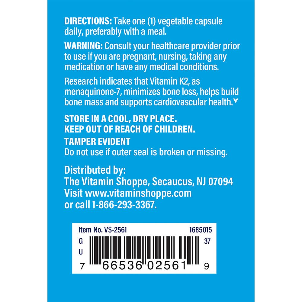 The Vitamin Shoppe K2 MK-7 capsules arranged on a wooden table