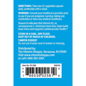 The Vitamin Shoppe K2 MK-7 capsules arranged on a wooden table