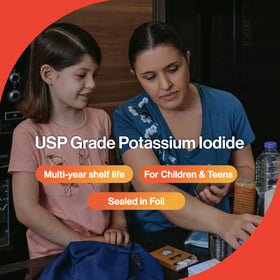 THYROSAFE Iode Potassique 65mg à côté d'un kit de survie