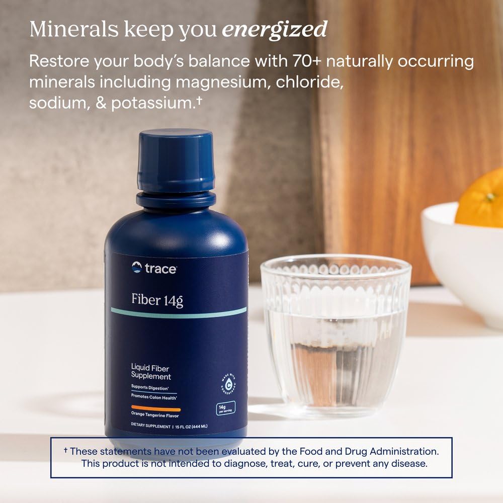 Trace Minerals Complément Alimentaire 15 fl oz sur une table avec des fruits