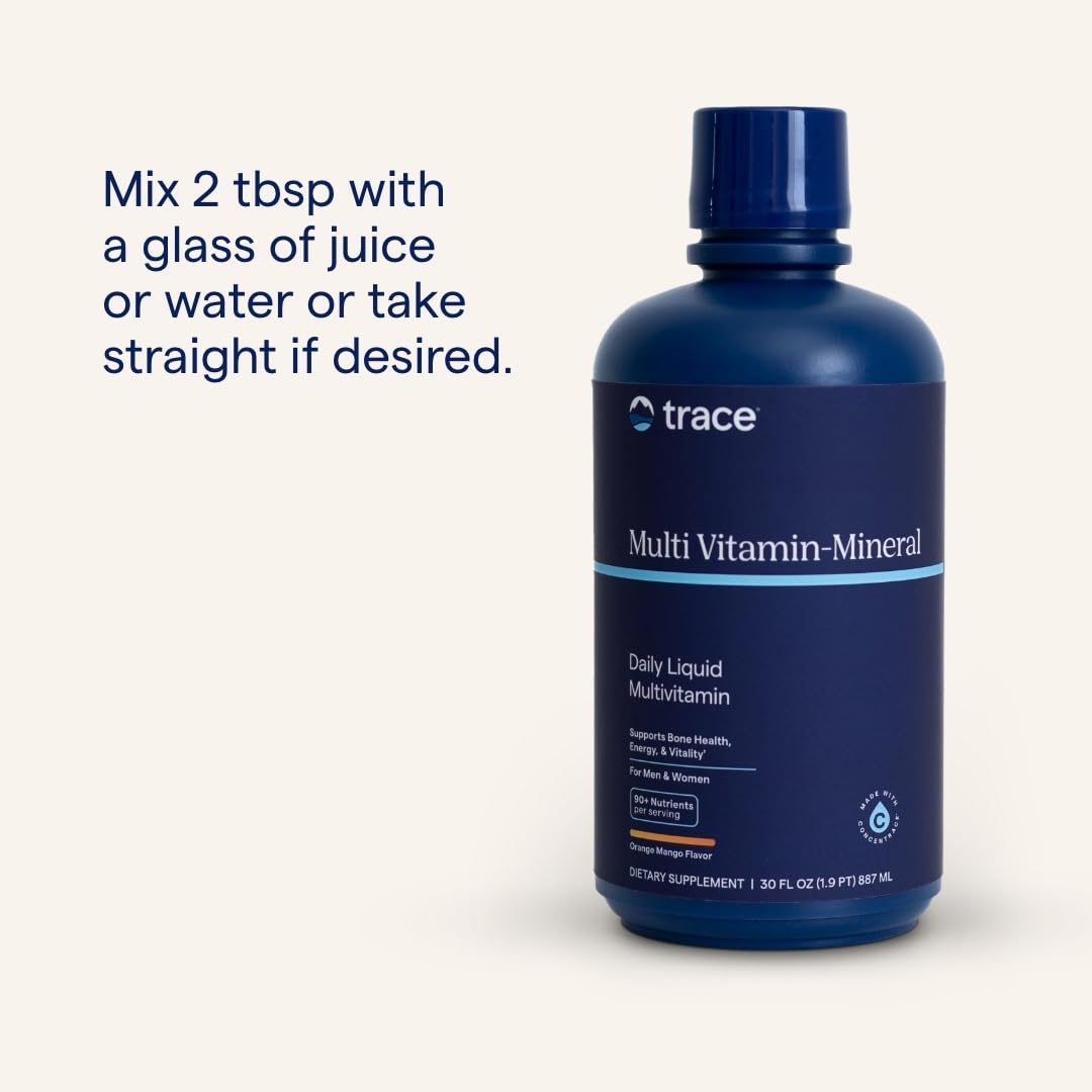 Trace Minerals Multivitamine Liquide 32 oz présentation sur une table en bois