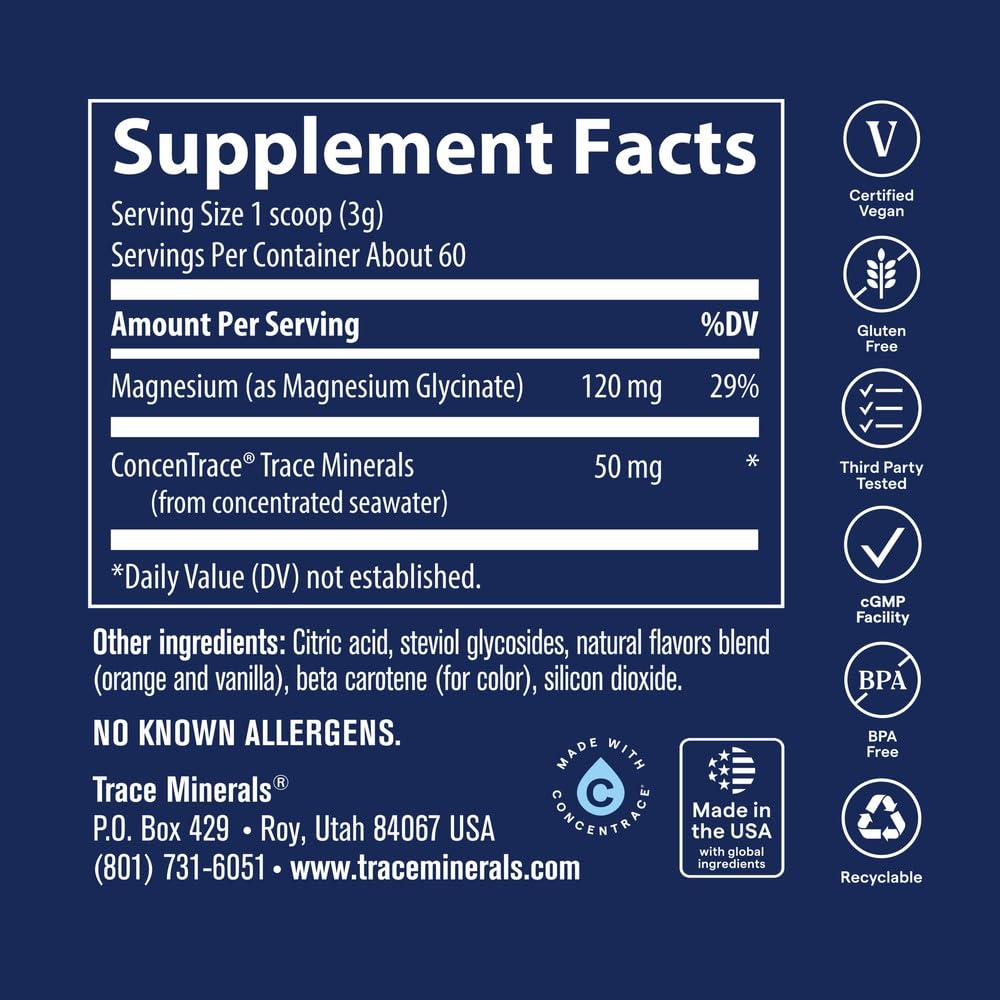 Trace Minerals Poudre de Magnésium Glycinate 240g à côté d'un verre d'eau