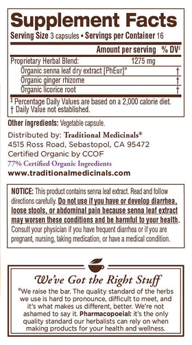 Traditional Medicinals Smooth Move Senna capsules with a glass of water