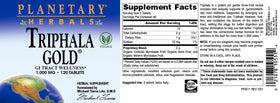 Triphala Gold 1000mg, comprimés sur une table avec des plantes