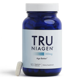 TRU NIAGEN Complément NAD+ 300mg près d'un livre de santé