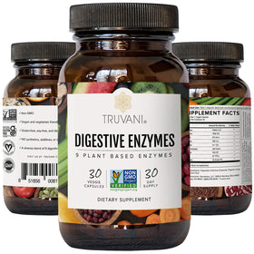 Truvani Enzymes daily à côté d'un verre d'eau