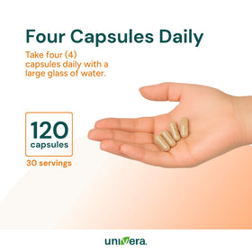 Univera km KAPS Potassium capsules à côté d'un verre d'eau