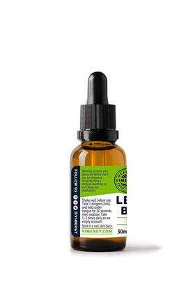 Vimergy Tincture de Mélisse Bio échantillon sur une table en bois