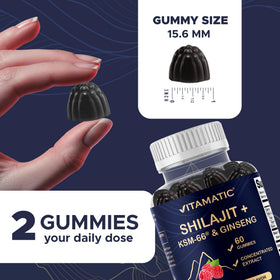 Vitamatic gummies on a wooden table with fresh raspberries