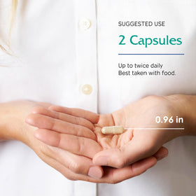 Vitanica ThyroFem capsules à côté d'un verre d'eau