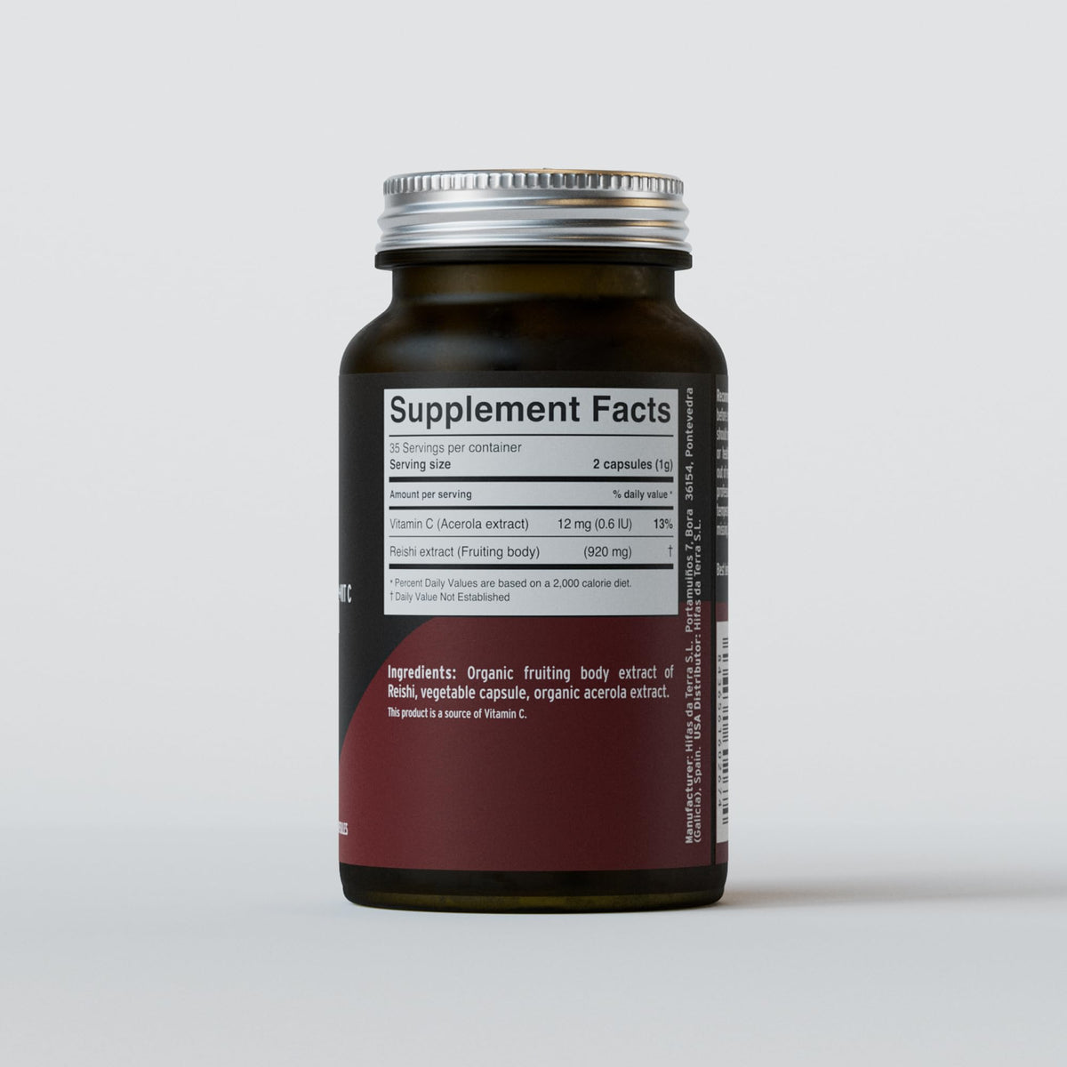 Vue de côté du pot de capsules de champignon Reishi bio