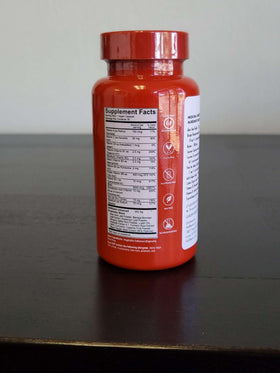 Vue du flacon HAIRtamin avec capsules en arrière-plan