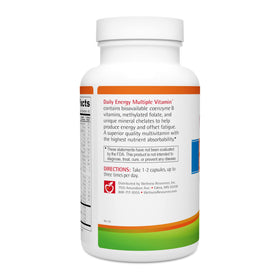 Wellness Resources Multivitamine à côté d'un verre d'eau