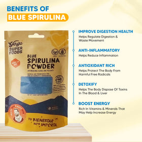 Yogi Super Foods Poudre de Spiruline Bleue 155g sur une table avec fruits