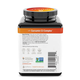 Youtheory Curcuma Extra Fort 1 000 mg mise en scène avec des plantes