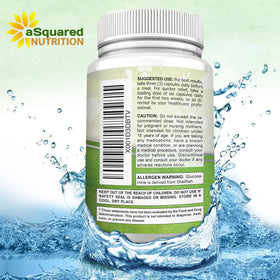 Zoom sur les capsules aSquared Nutrition avec des ingrédients naturels en arrière-plan