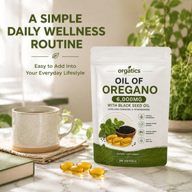 Zyvoxen gélules d'huile d'origan et de nigelle en main